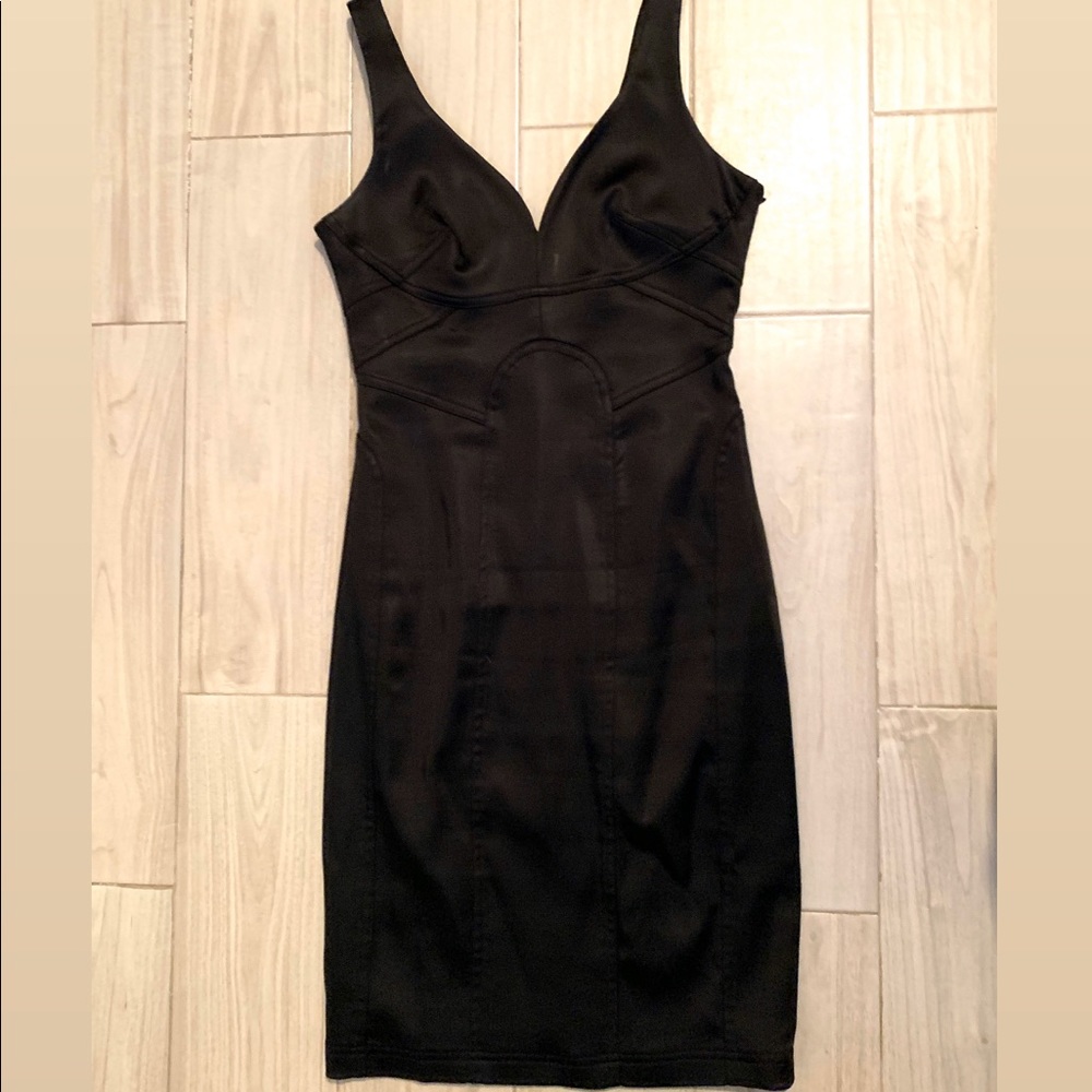 Fitted black plunging neck line dress.